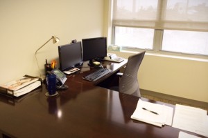 Picture of Melissa’s corner desk set up before ergo assessment.